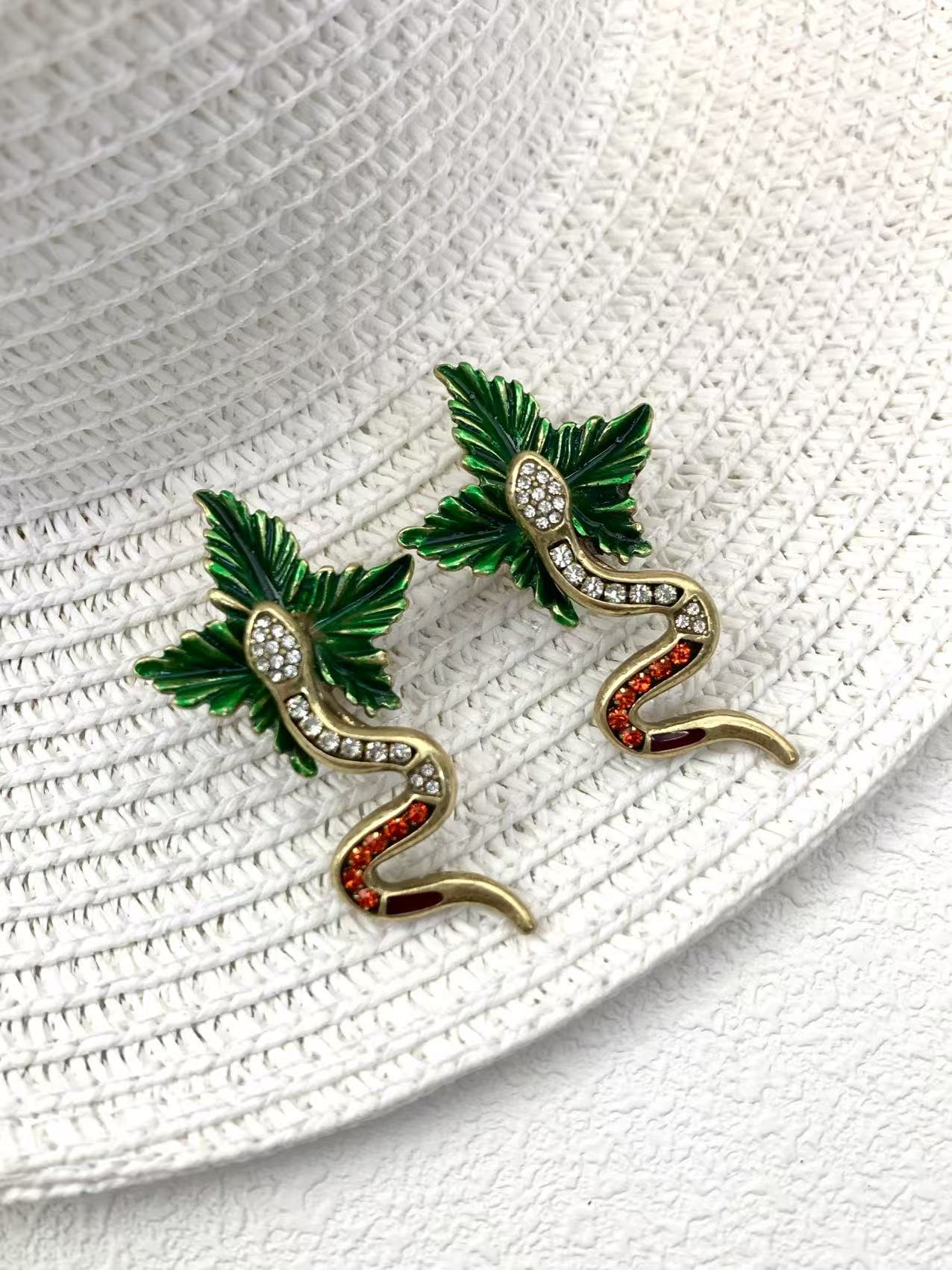 Artisan Brass Serpent Earrings: Vintage Statement Piece with Micro-Pave Crystal Detailing